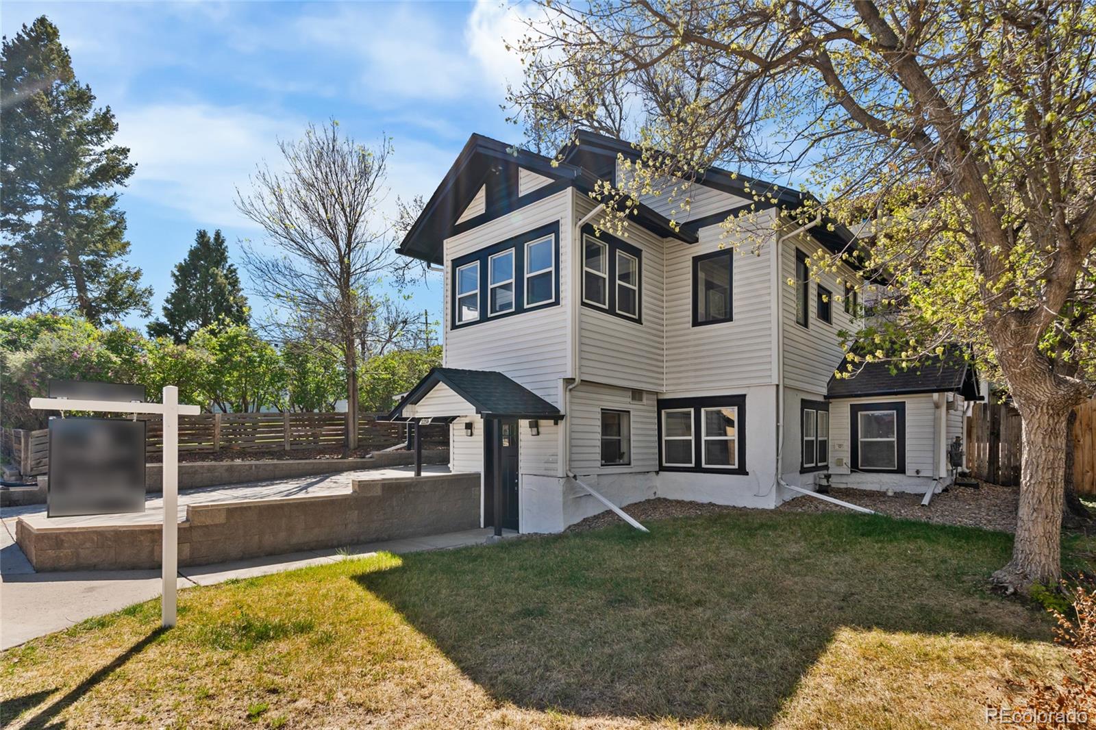 2259 Depew Street Edgewater, CO 80214 - Photo 3 of 46 a view of a white house with a big yard and large tree