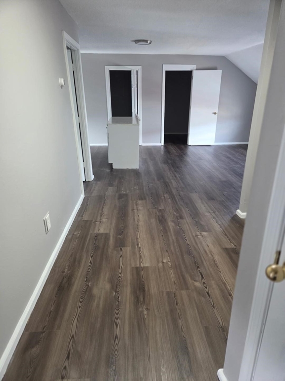 14 Carver Street, Unit 3 Fall River, MA 02721 - Photo 5 of 8 wooden floor in an empty room with a window