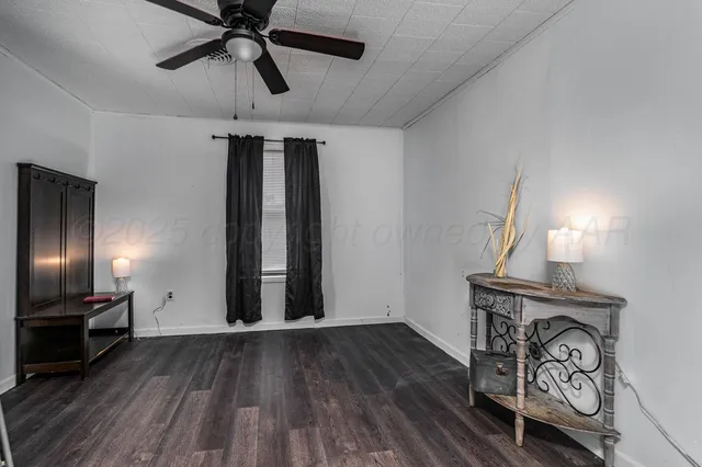 a view of an entryway with wooden floor