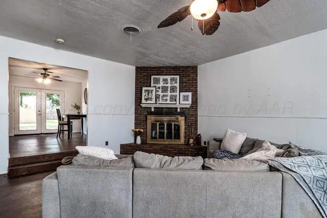 a living room with furniture and window