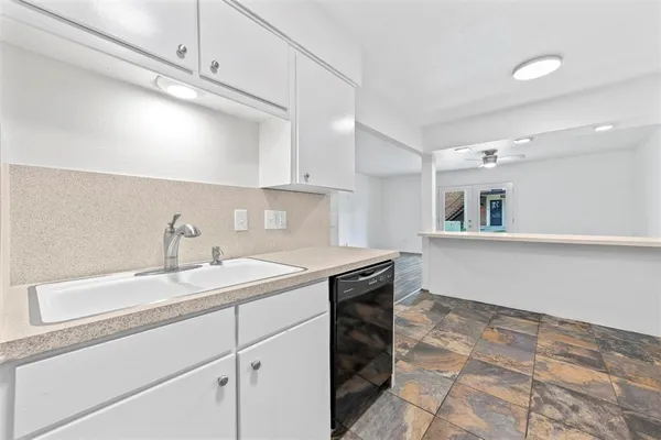 a kitchen with a sink and a cabinets