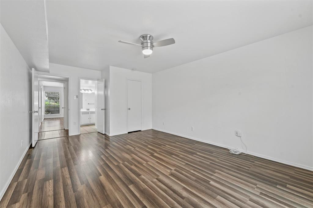 4002 Ridglea Country Club Drive Fort Worth, TX 76126 - Photo 18 of 36 wooden floor in an empty room with a window