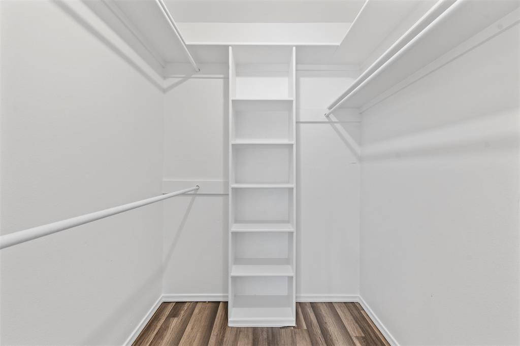 4002 Ridglea Country Club Drive Fort Worth, TX 76126 - Photo 19 of 36 a view of walk in closet with empty racks