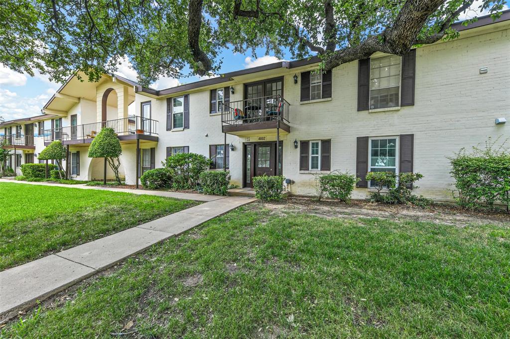 4002 Ridglea Country Club Drive Fort Worth, TX 76126 - Photo 33 of 36 a front view of a house with a yard and trees
