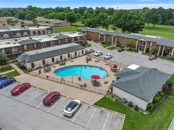 an aerial view of a house with outdoor space