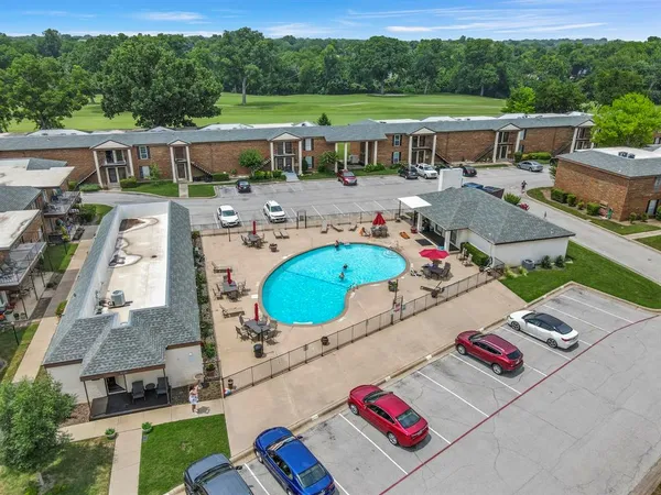 an aerial view of a house with outdoor space