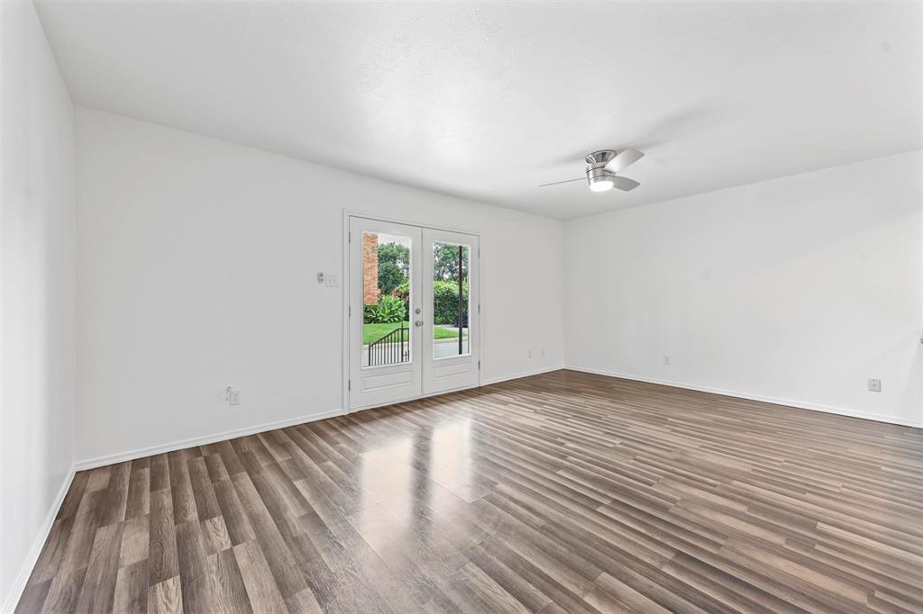 4002 Ridglea Country Club Drive Fort Worth, TX 76126 - Photo 7 of 36 wooden floor in an empty room with a window