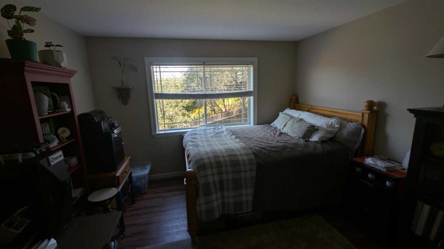 3248 Sudbury Road Cameron Park, CA 95682 - Photo 41 of 41 a bed sitting in a bedroom next to a window