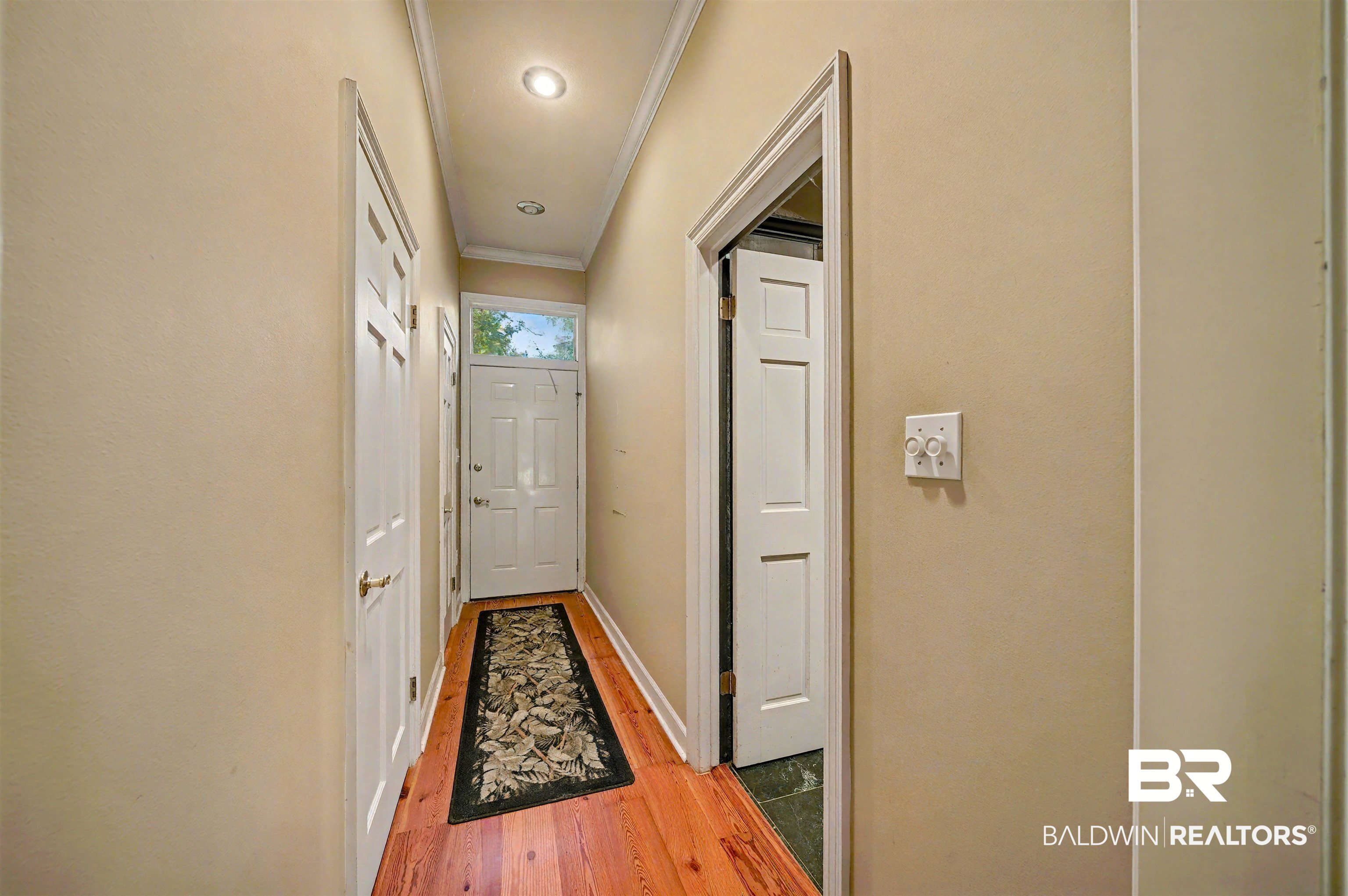 15810 County Road 73 Foley, AL 36535 - Photo 28 of 56 Hallway featuring crown molding and light wood-type flooring