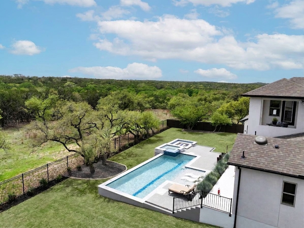 546 Bridge Water Loop Dripping Springs, TX 78620 - Photo 37 of 40 a view of house with backyard outdoor seating and hardwood