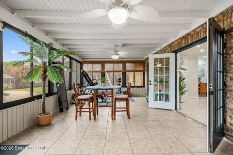 a living room with furniture and dining table