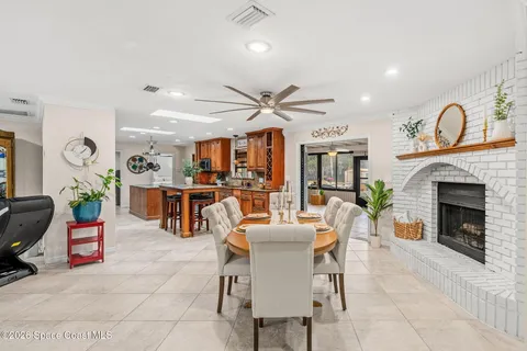 a dining room with furniture and a clock