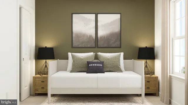 a bedroom with a bed and lamp