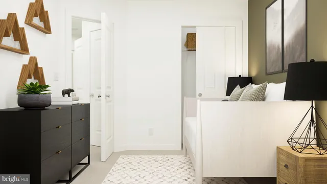 a bedroom with a bed and cabinets