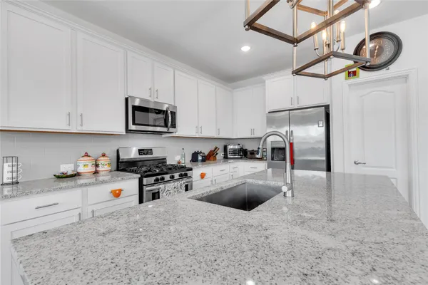 a kitchen with cabinets and window