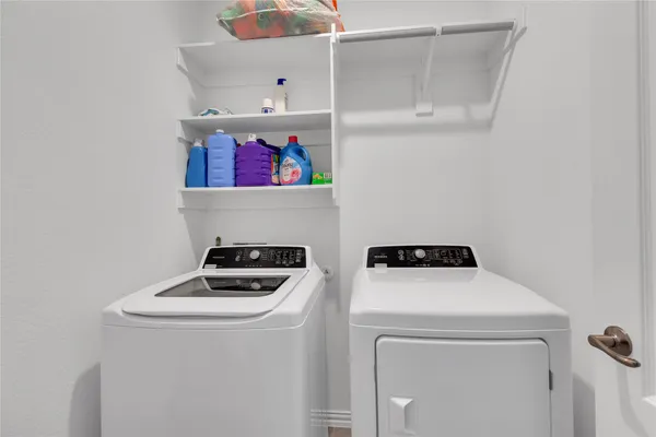 a bathroom with a bathtub a sink and a window