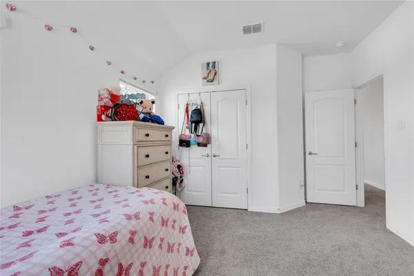 a bedroom with a bed and closet