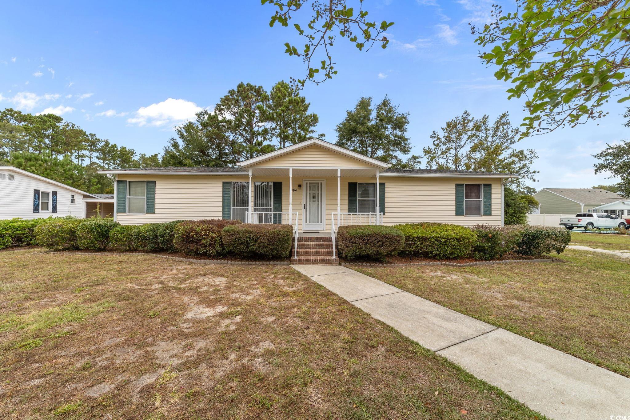 894 South Marlin Circle Murrells Inlet, SC 29576 - Photo 1 of 40 Single story home featuring a front lawn and a porch