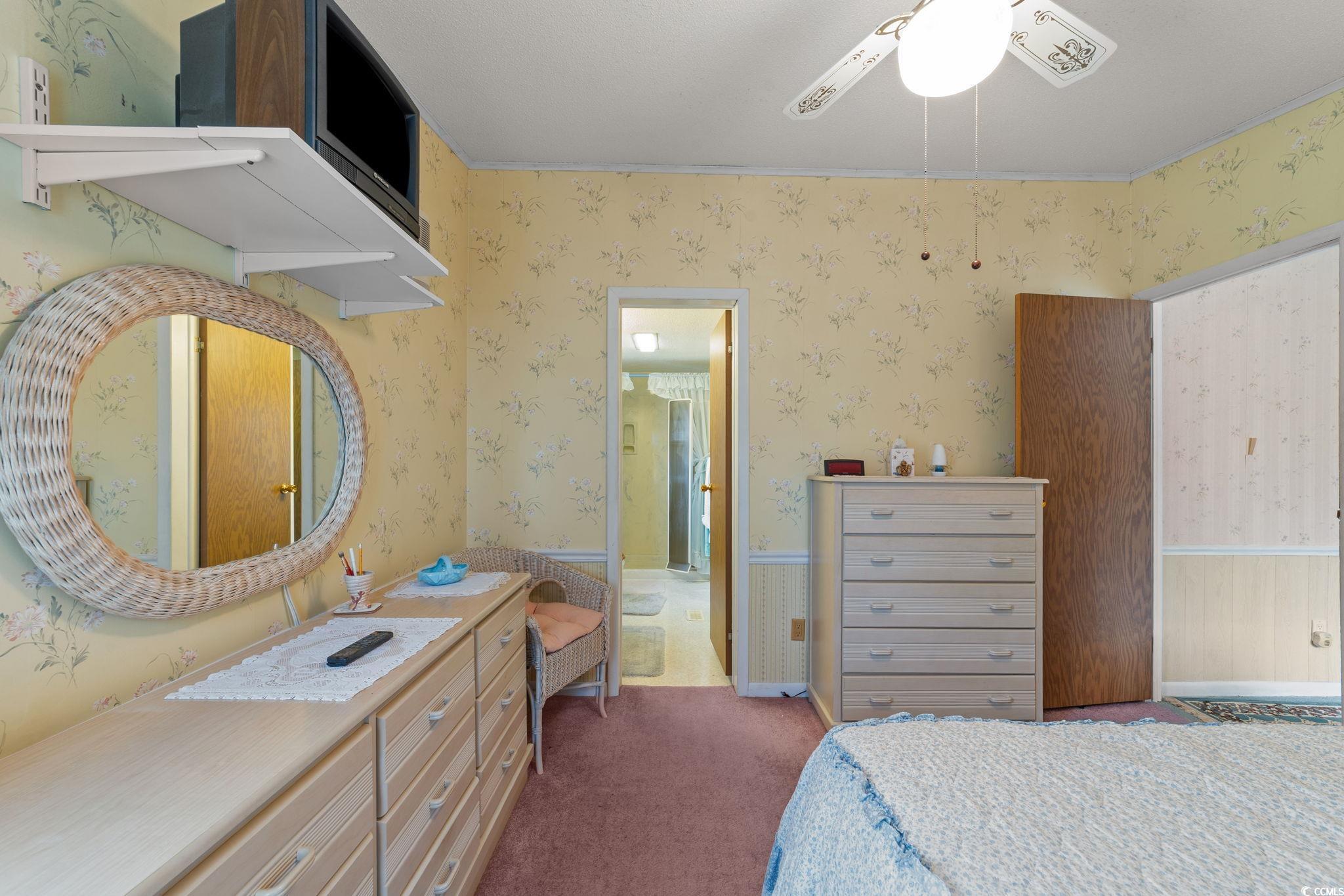 894 South Marlin Circle Murrells Inlet, SC 29576 - Photo 24 of 40 Carpeted bedroom featuring ceiling fan, wallpapered walls, and connected bathroom