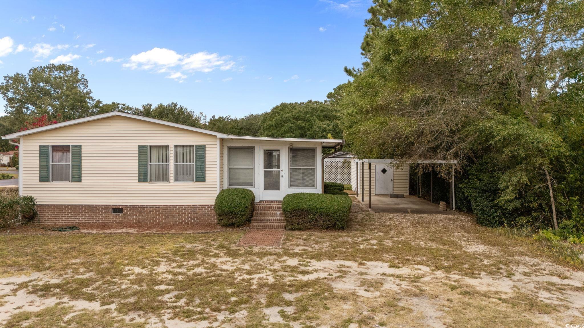894 South Marlin Circle Murrells Inlet, SC 29576 - Photo 35 of 40 Manufactured / mobile home featuring a sunroom, crawl space, and entry steps
