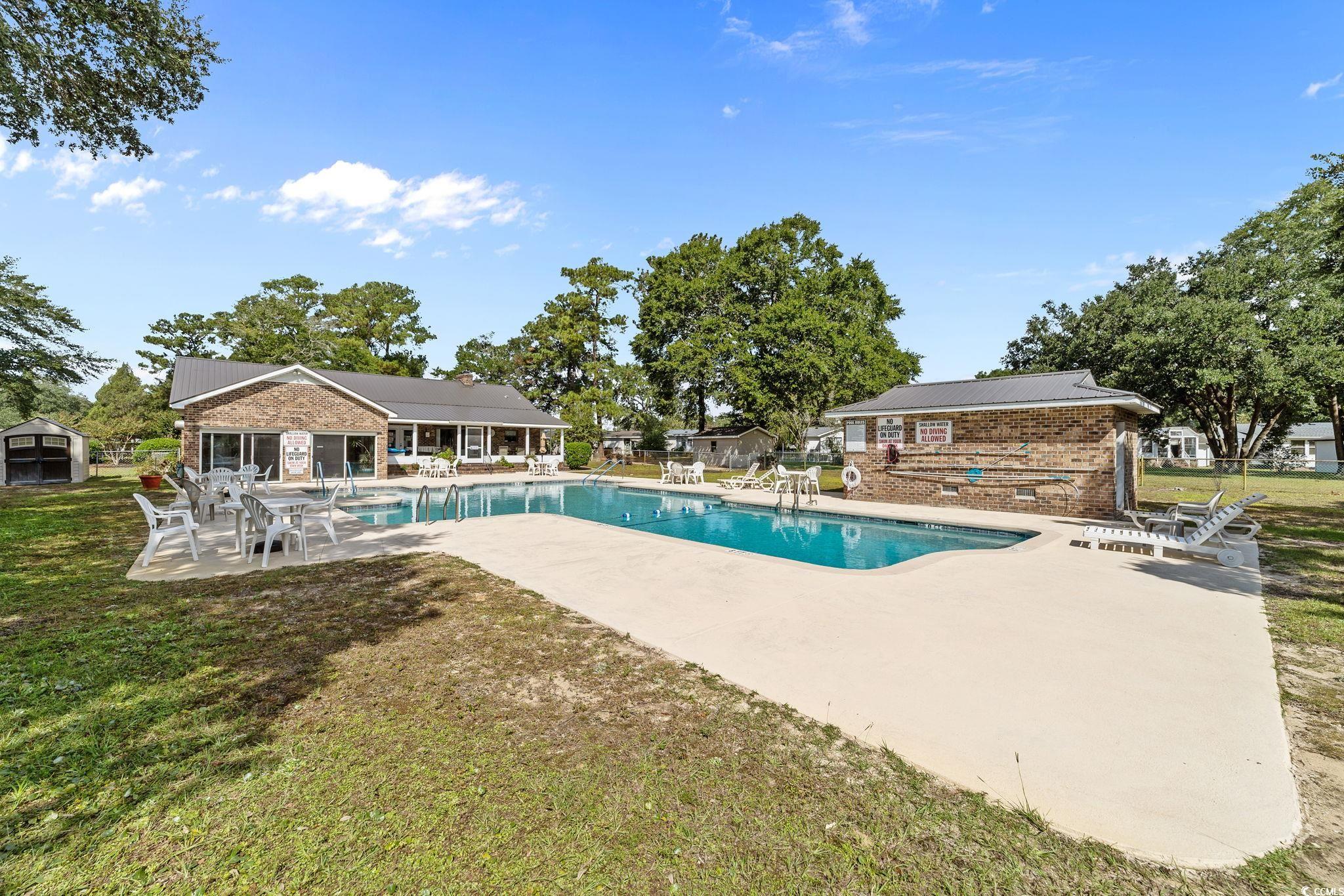 894 South Marlin Circle Murrells Inlet, SC 29576 - Photo 37 of 40 Community pool featuring a patio area and an outdoor structure
