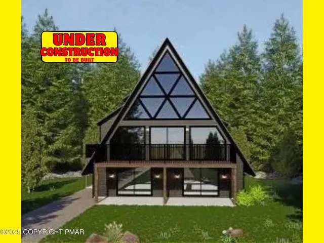 a front view of a house with a yard and a fence