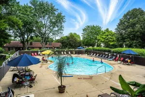 a view of a swimming pool with a patio