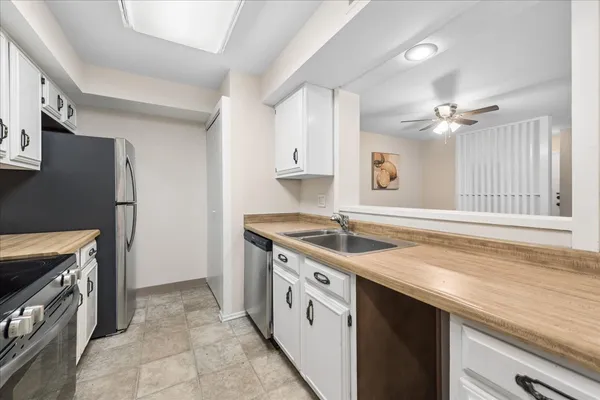 a kitchen with a stove and a sink