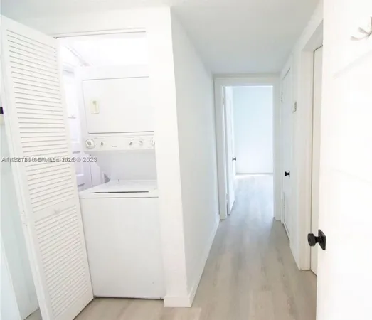 a view of bathroom with washer and dryer