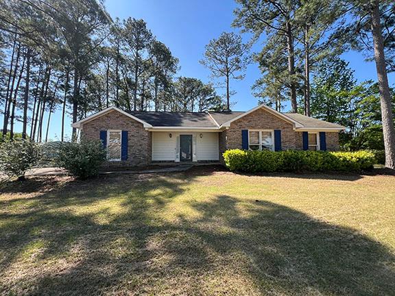 a house with swimming pool in front of it