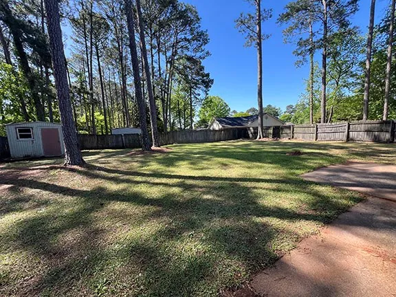 a backyard of a house with lots of green space