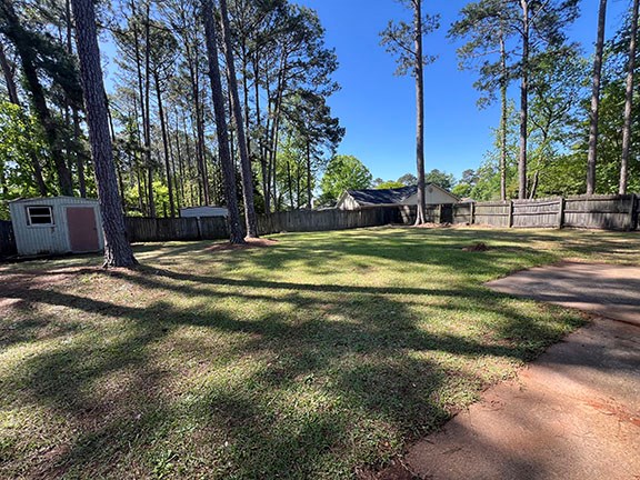 1 Handshaker Lane Columbus, GA 31909 - Photo 2 of 17 a backyard of a house with lots of green space