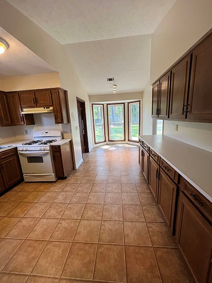 1 Handshaker Lane Columbus, GA 31909 - Photo 7 of 17 a kitchen with stainless steel appliances granite countertop a stove a sink and a microwave