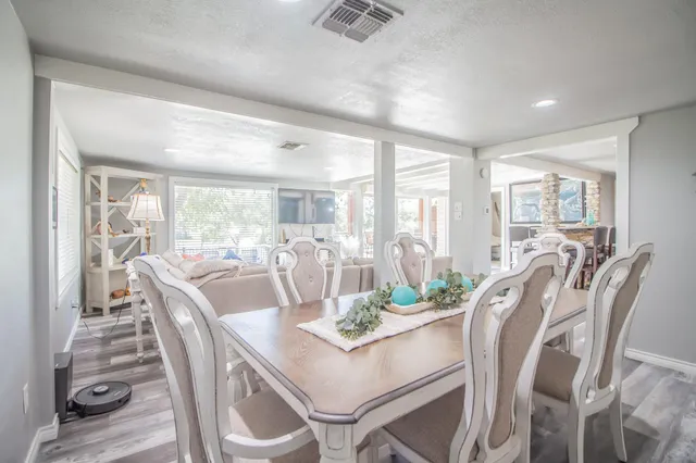 a view of a dining room with furniture window and wooden floor
