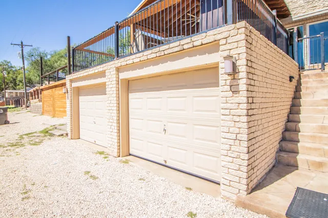 a view of a house with a snow on the road