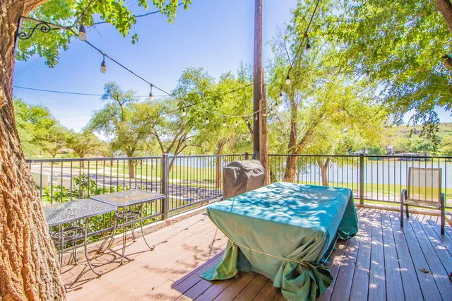 a view of a balcony with wooden floor