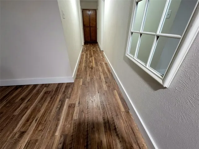 a view of wooden floor in a bathroom