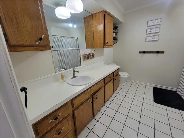 a bathroom with a sink a mirror and a shower