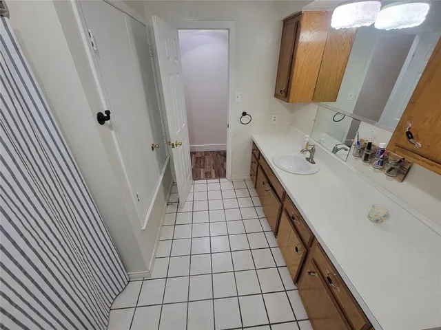 a bathroom with a double vanity sink a mirror and vanity