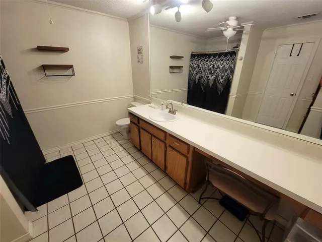 a room with a sink and a mirror