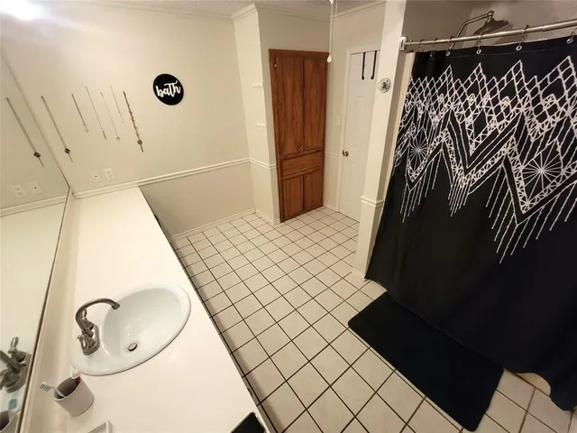a bathroom with a bathtub and shower