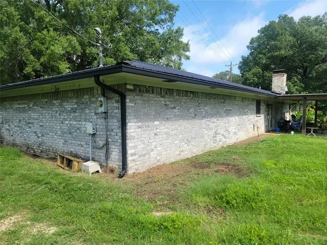 a backyard of a house with lots of green space