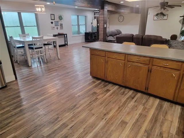 a living room with furniture a wooden floor