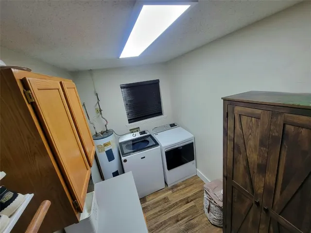 a view of a workspace with furniture and washing machine