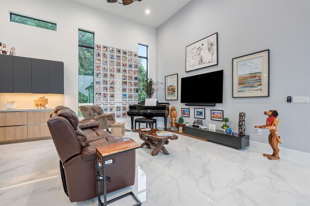 13500 Stirling Road Southwest Ranches, FL 33330 - Photo 15 of 72 a view of a livingroom with workspace and a couch