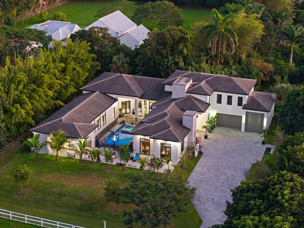 13500 Stirling Road Southwest Ranches, FL 33330 - Photo 2 of 72 a view of house with garden space and street view