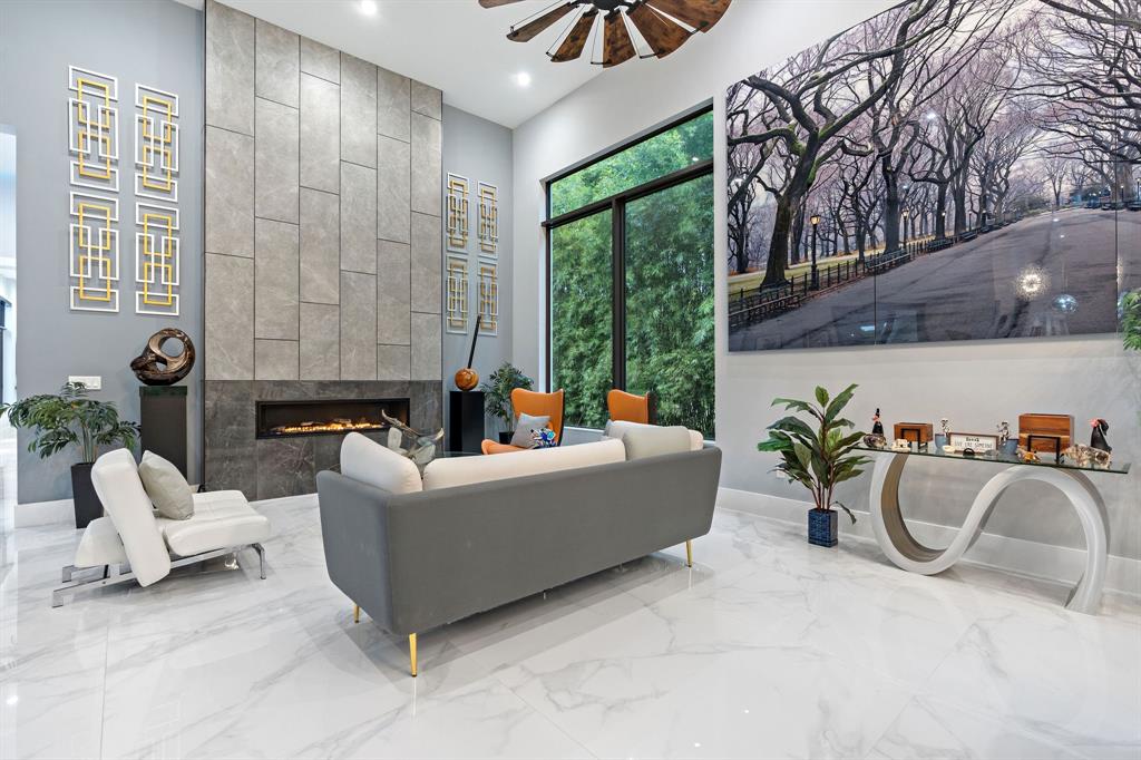 13500 Stirling Road Southwest Ranches, FL 33330 - Photo 23 of 72 a living room with furniture and a table