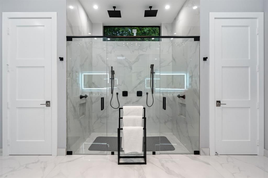 13500 Stirling Road Southwest Ranches, FL 33330 - Photo 38 of 72 a bathroom with a glass shower door