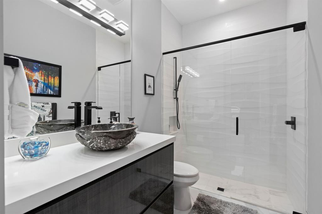 13500 Stirling Road Southwest Ranches, FL 33330 - Photo 41 of 72 a bathroom with a sink a toilet and shower