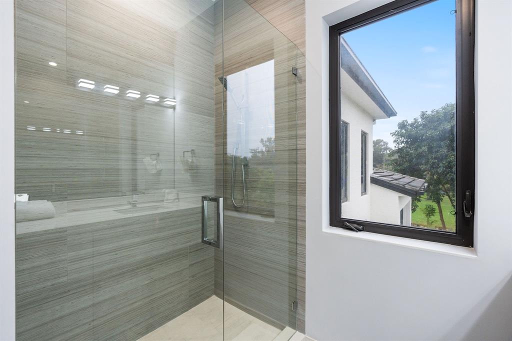 13500 Stirling Road Southwest Ranches, FL 33330 - Photo 43 of 72 a bathroom with a bathtub and a shower